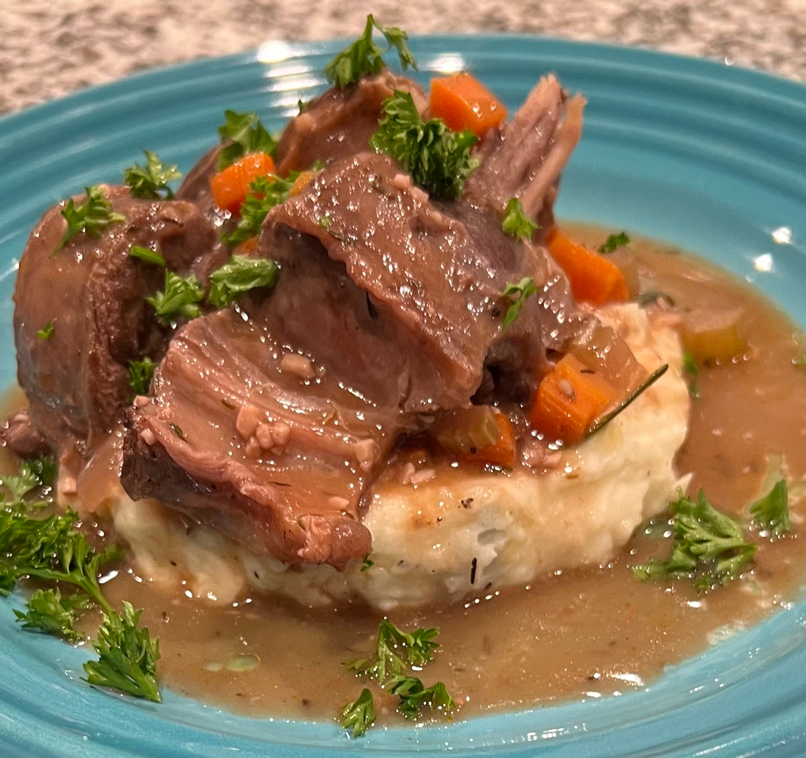Braised lamb shank w/ roasted garlic mash